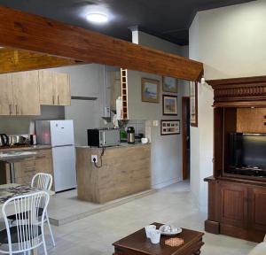 a kitchen with a counter top and a kitchen with at Mabel View in Cape Town