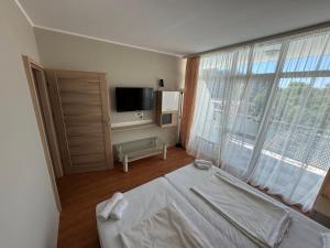 TV a/nebo společenská místnost v ubytování Oasis-Apartament