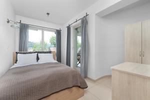 Ένα ή περισσότερα κρεβάτια σε δωμάτιο στο Przestronne Apartamenty w Zakopanem z Trzema Sypialniami i Parkingiem by Noclegi Renters