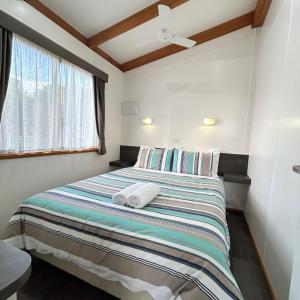 Postel nebo postele na pokoji v ubytování Rutherglen Holiday Park