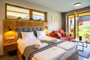 Ένα ή περισσότερα κρεβάτια σε δωμάτιο στο Apartament Tymkowa Polana by Apart Concept Podhale