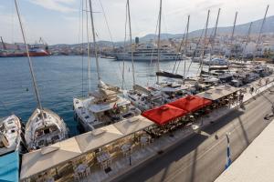 a bunch of boats are docked in a harbor at Harbour View Holiday Home in Ermoupoli