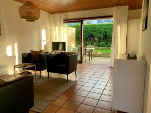 a living room with a couch and a table at Haus Elstar in Bodman-Ludwigshafen +6 photos