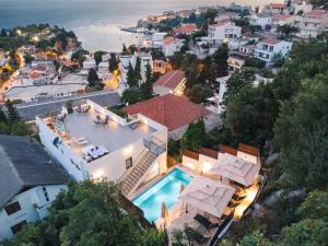 an aerial view of a house with a swimming pool at Casa Bianca & Spa in Ulcinj