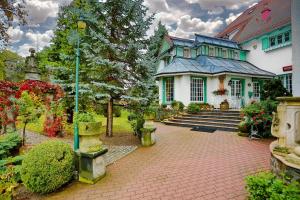 Vonkajšia záhrada v ubytovaní Hotel Garden