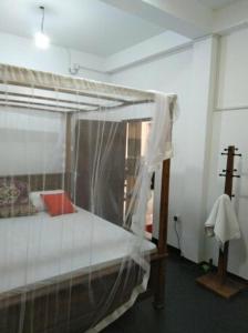 Postel nebo postele na pokoji v ubytování Parei Beach Inn