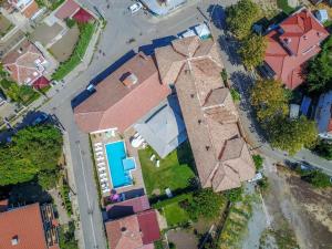 an overhead view of a house with a pool at Хотел Черноморец in Chernomorets