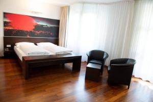 A bed or beds in a room at arte Hotel Linz