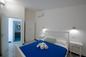 Кровать или кровати в номере Terrazza sul mare