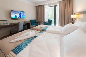 Postel nebo postele na pokoji v ubytování Hotel Ewerdin