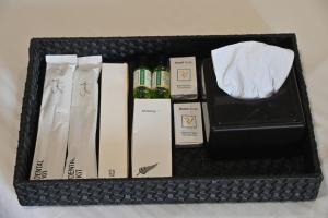 a black box with bottles of wine and napkins at Hotel Sai Yatri in Trimbak