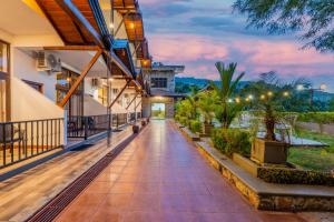 an external view of a building with a walkway at Eagle Regency Hotel in Kandy