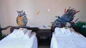 Postel nebo postele na pokoji v ubytování Leto Hotel