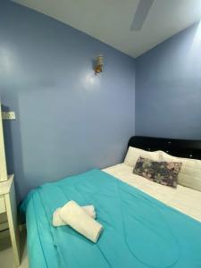 Postel nebo postele na pokoji v ubytování A&P Inn Homestay Machang