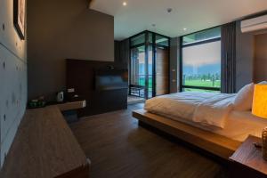Postel nebo postele na pokoji v ubytování Juan Teppan-yaki B&B