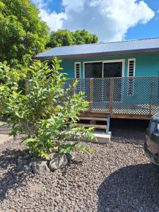 a house with a bench in front of it at Keamana Lodge 1 in Bora Bora