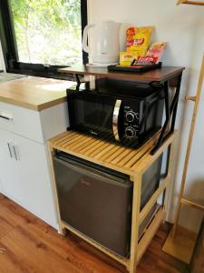 A cozinha ou kitchenette de How Hide Homestay