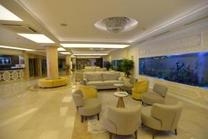 a lobby with a large aquarium in a hotel at White Gold Hotel & Spa in Alanya