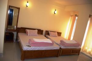 Katil atau katil-katil dalam bilik di Pokhrel Lodge