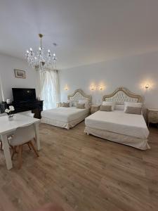 a large bedroom with two beds and a piano at Studio familial du Cloitre in Narbonne