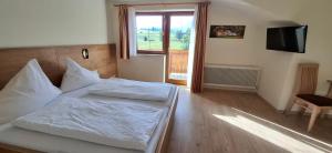 Postel nebo postele na pokoji v ubytování Pension Stammerhof