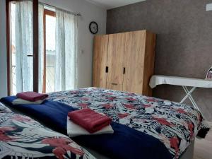 Llit o llits en una habitació de Apartman Rita
