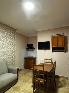 a living room with a table and a couch at Family hotel in Grigoleti in Grigoleti