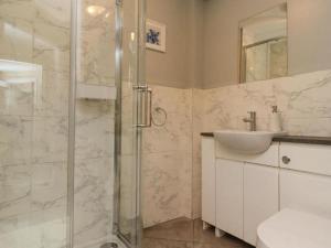 a bathroom with a shower and a sink at Apartments at The Black in Wark +59 photos