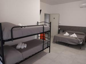 Postel nebo postele na pokoji v ubytování Villa3 Cancelli Guesthouse B&B via del Mare Formia
