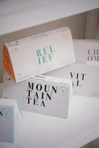 a pile of boxes sitting on a shelf at Dogpound Hotel in Athens