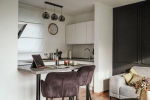 a kitchen with a table with a laptop on it at Auszeit - Detmold in Detmold