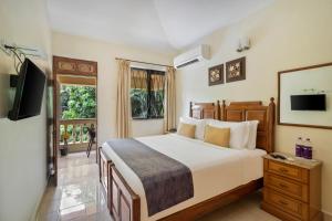 Voodi või voodid majutusasutuse De Mandarin Beach Resort Suites & Villas, Candolim toas