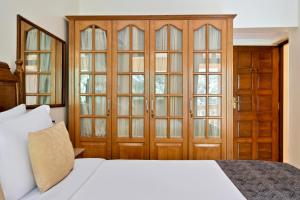 Voodi või voodid majutusasutuse De Mandarin Beach Resort Suites & Villas, Candolim toas