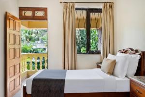 Voodi või voodid majutusasutuse De Mandarin Beach Resort Suites & Villas, Candolim toas
