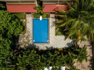 Bazén v ubytování De Mandarin Beach Resort Suites & Villas, Candolim nebo v jeho okolí