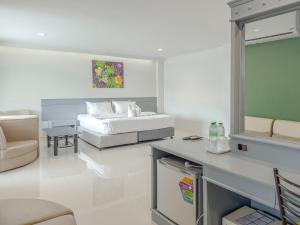 Postel nebo postele na pokoji v ubytování Xanadu Hotel Utapao
