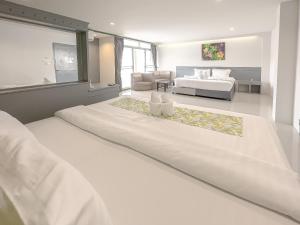 Postel nebo postele na pokoji v ubytování Xanadu Hotel Utapao