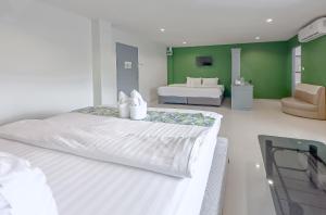 Postel nebo postele na pokoji v ubytování Xanadu Hotel Utapao