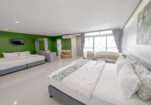 Postel nebo postele na pokoji v ubytování Xanadu Hotel Utapao