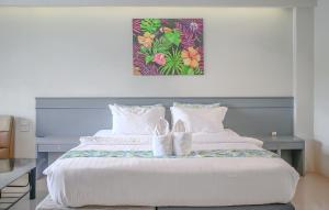 Postel nebo postele na pokoji v ubytování Xanadu Hotel Utapao