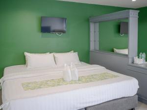 Postel nebo postele na pokoji v ubytování Xanadu Hotel Utapao