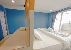 Postel nebo postele na pokoji v ubytování Xanadu Hotel Utapao