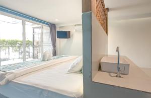 Postel nebo postele na pokoji v ubytování Xanadu Hotel Utapao