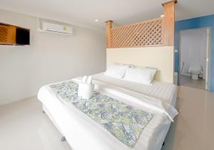 Postel nebo postele na pokoji v ubytování Xanadu Hotel Utapao