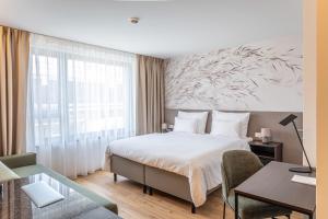 Voodi või voodid majutusasutuse Hotel DAS SAAL toas