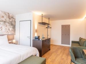 Voodi või voodid majutusasutuse Hotel DAS SAAL toas