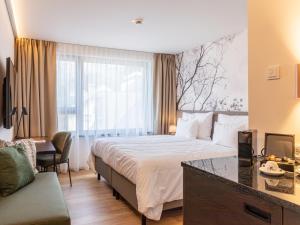 Voodi või voodid majutusasutuse Hotel DAS SAAL toas