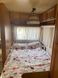 a bed in the middle of an rv at Mi Cachito in Los Caños de Meca