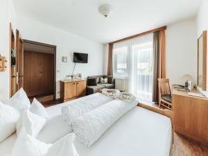 Letto o letti in una camera di Regitnig - 4 Sterne Hotel und Chalets