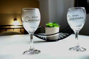 two wine glasses sitting on top of a table at B&B Cindra in Karlovac